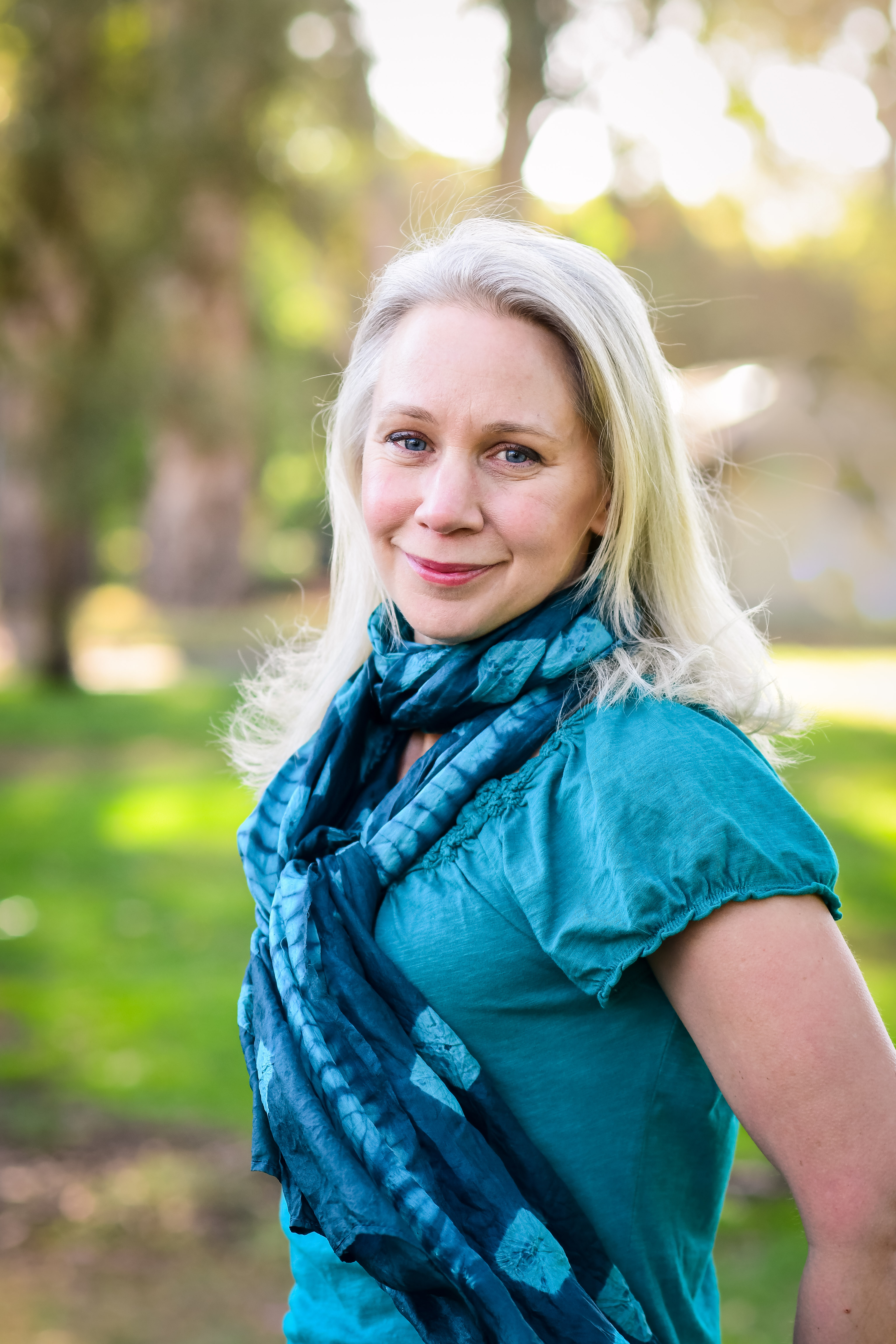Portrait of Anna outdoors among trees